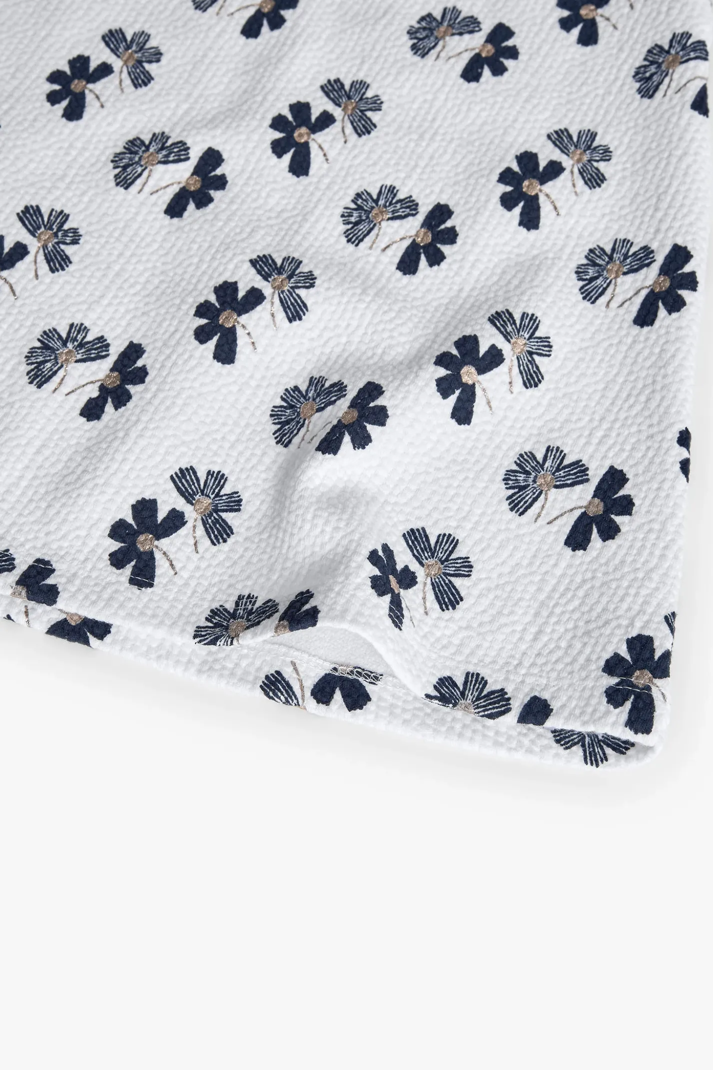 Abito in maglia per bambina con design floreale in bianco e nero.