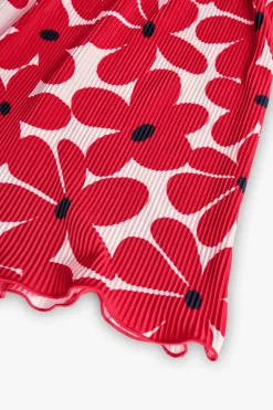 Abito in maglia per bambina con motivo floreale in rosso e bianco.