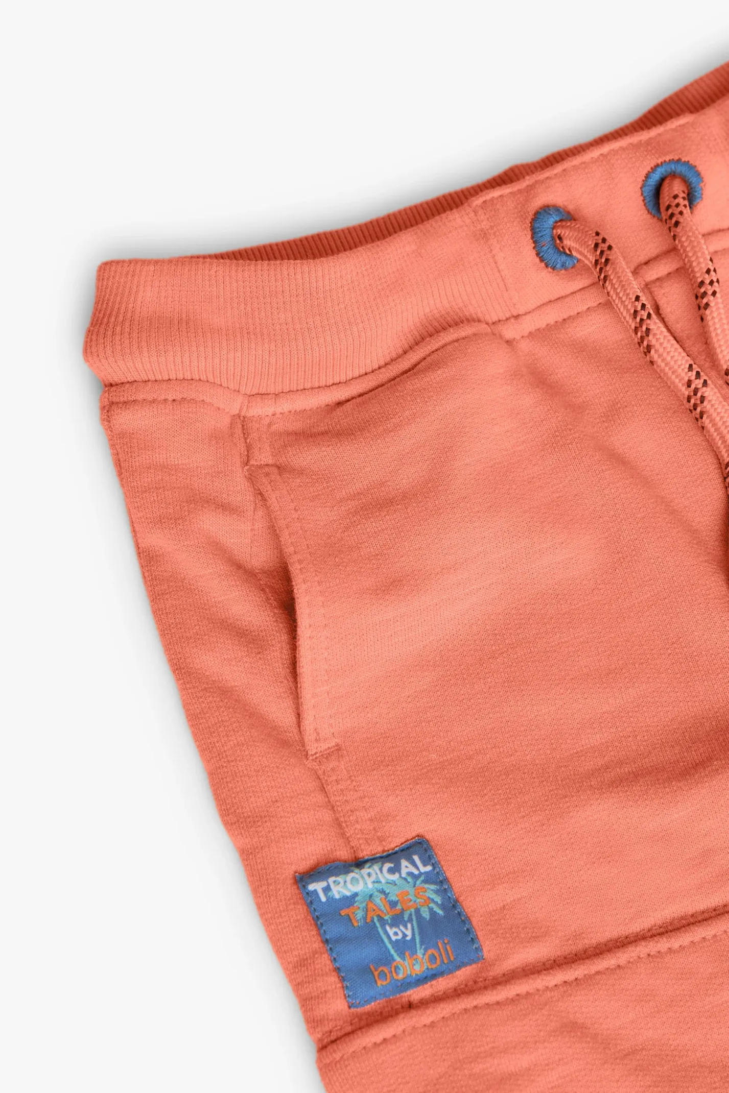 Bermuda a maglia per bambino in colore arancione