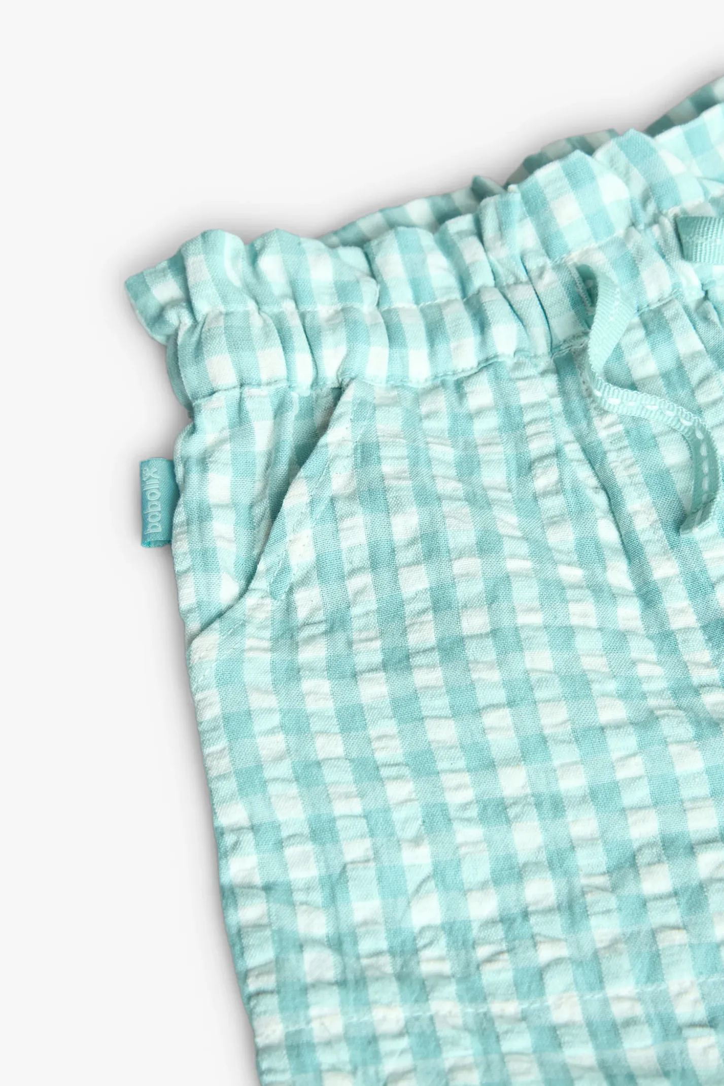 Bermuda in popeline per bambina verde con stampa a quadri.