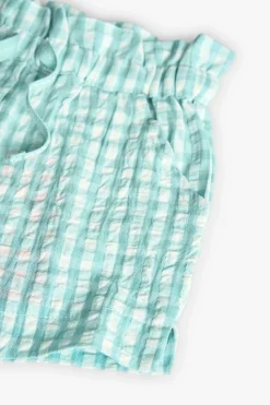 Bermuda in popeline per bambina verde con stampa a quadri.