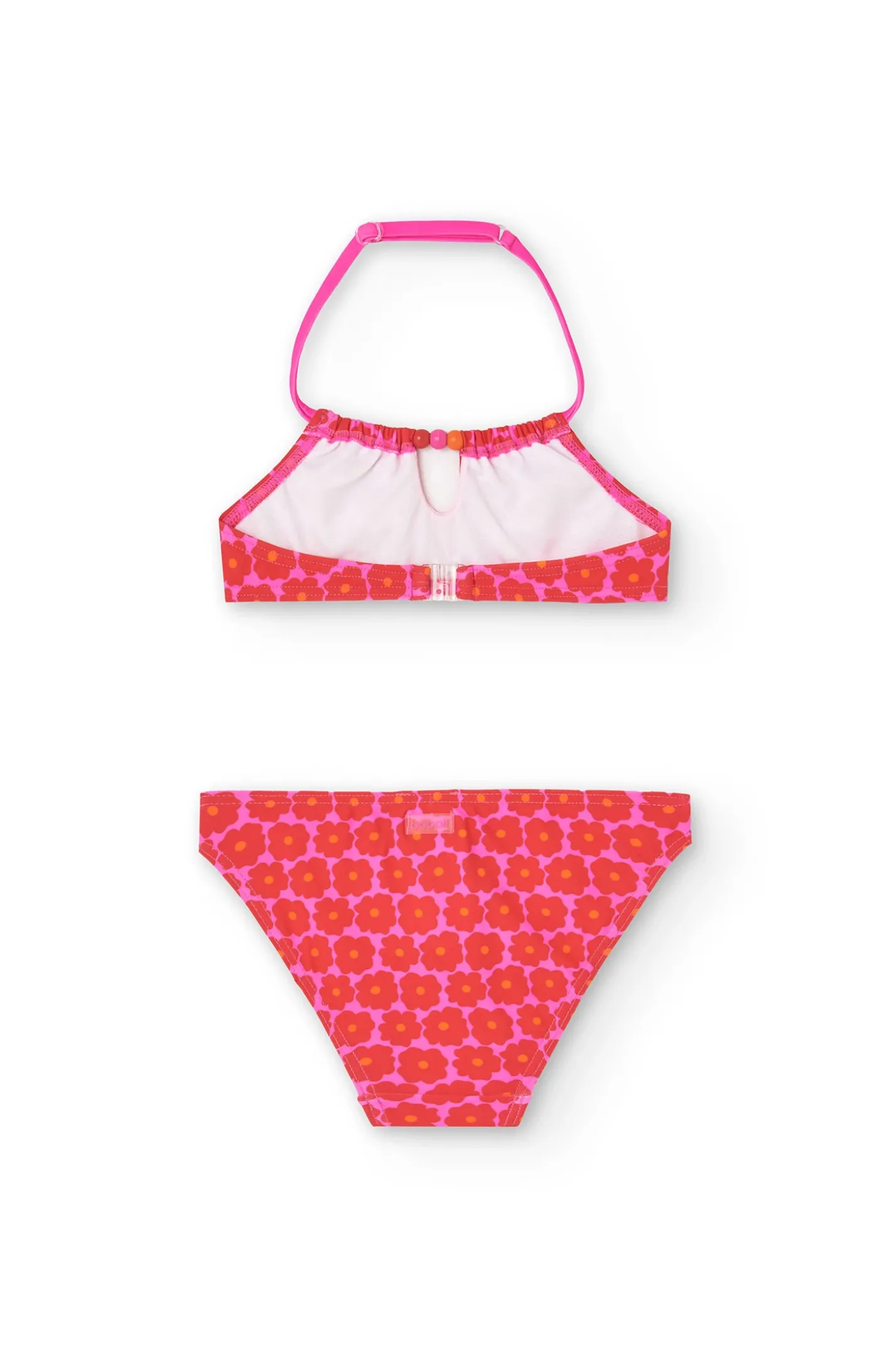 Bikini in poliammide per bambina con stampa floreale di colore rosa.