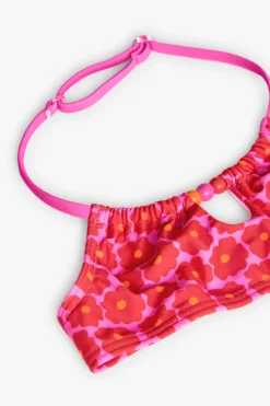 Bikini in poliammide per bambina con stampa floreale di colore rosa.