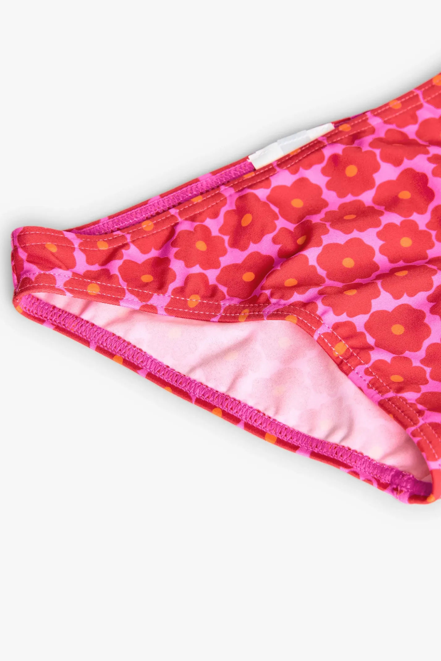 Bikini in poliammide per bambina con stampa floreale di colore rosa.