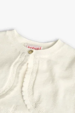Bolero in maglia per neonata in bianco.