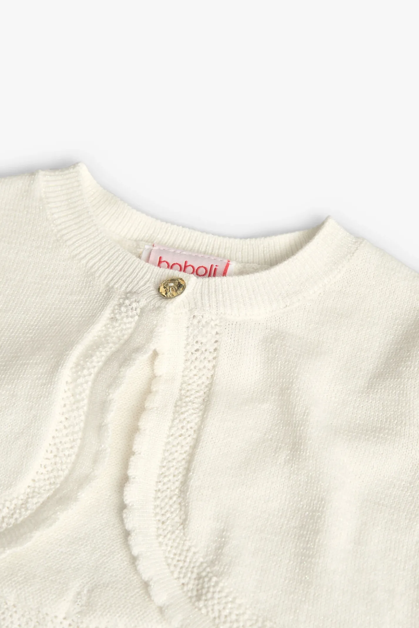 Bolero in maglia per neonata in bianco.