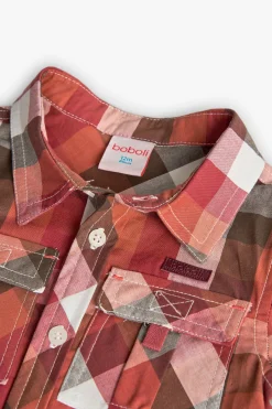 Camicia in popeline per bambino con quadri in tonalità calde.