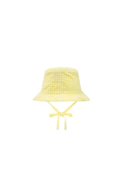Cappello di popeline per bebè di colore giallo con motivo a quadri.