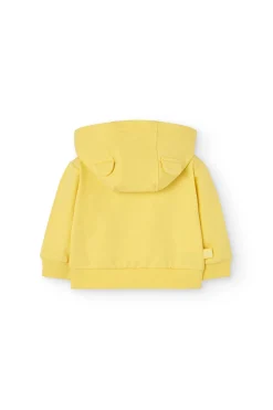 Cardigan per neonato di colore giallo.