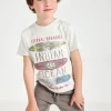 Completo con maglietta a maglia per bambino in colore crema.