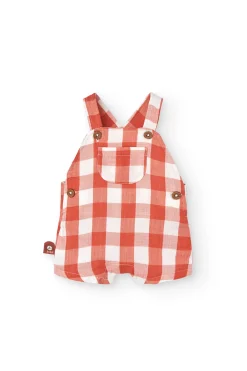 Completo coordinato in maglia per neonato in arancione e bianco con motivo a quadri.