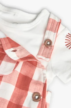 Completo coordinato in maglia per neonato in arancione e bianco con motivo a quadri.