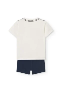 Completo di maglietta e pantaloncini in maglia per bambino in colore bianco.