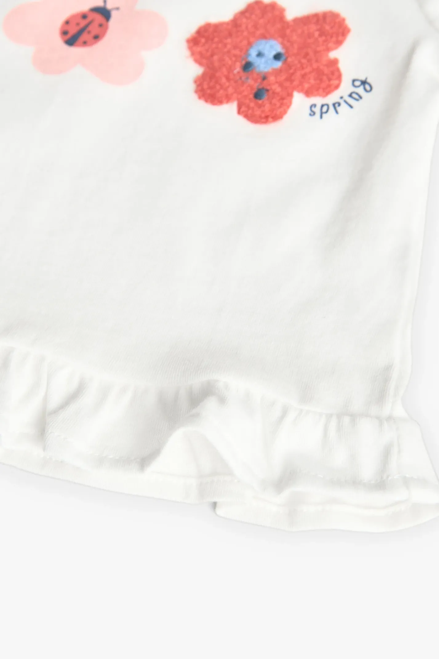 Completo di maglietta e pantaloni in maglia per neonata con stampa floreale.