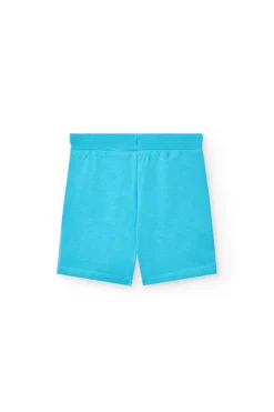 Completo in maglia per neonato di colore bianco con stampa e pantaloncini di colore blu.