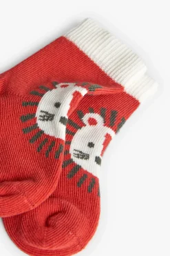 Confezione di calzini a maglia per bambino in colore arancione.