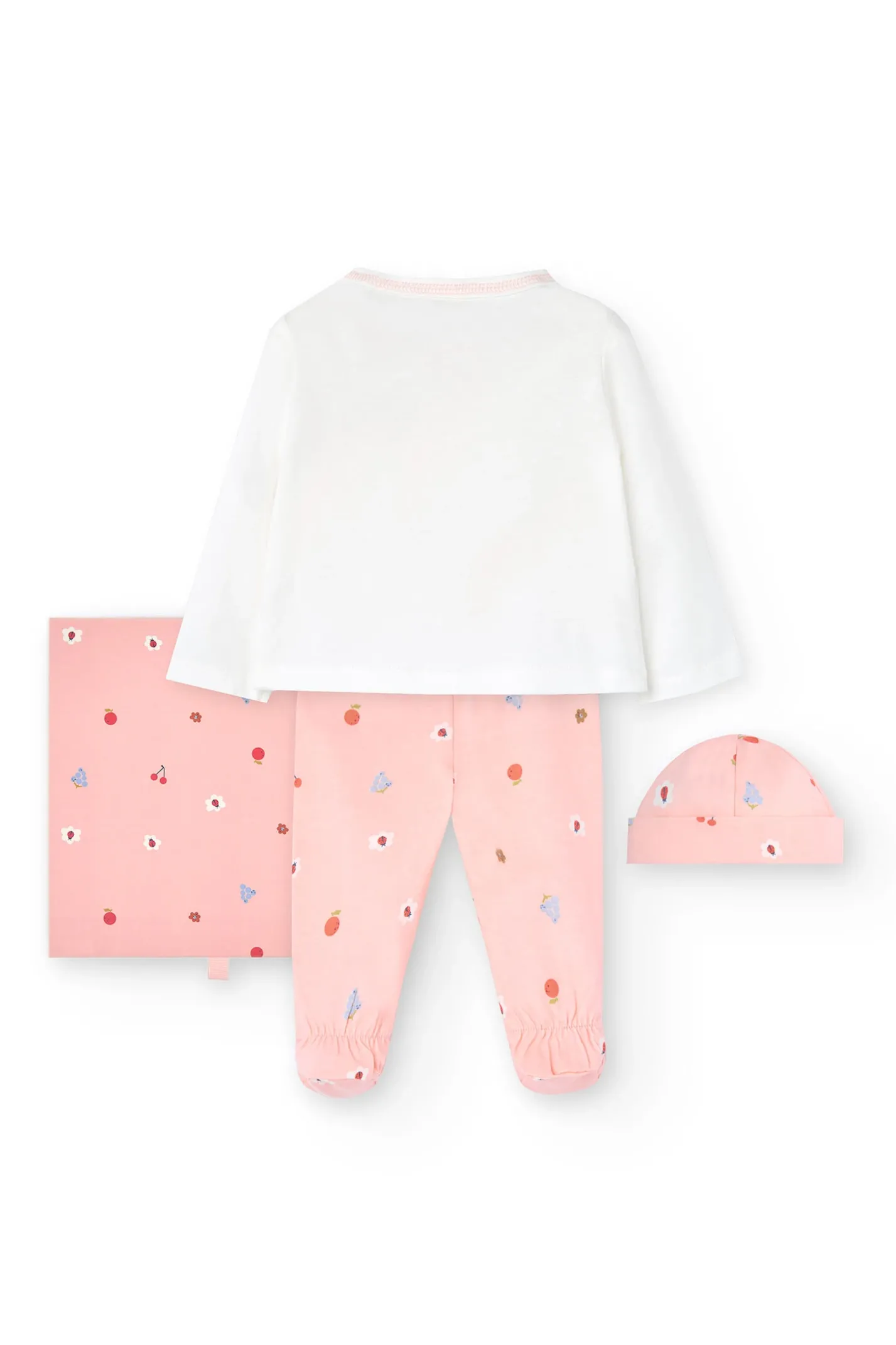 Coordinato in maglia per bambina in bianco e rosa.