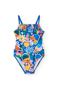 Costume da bagno in poliammide per bambina con stampa di frutta e fiori in colore blu.