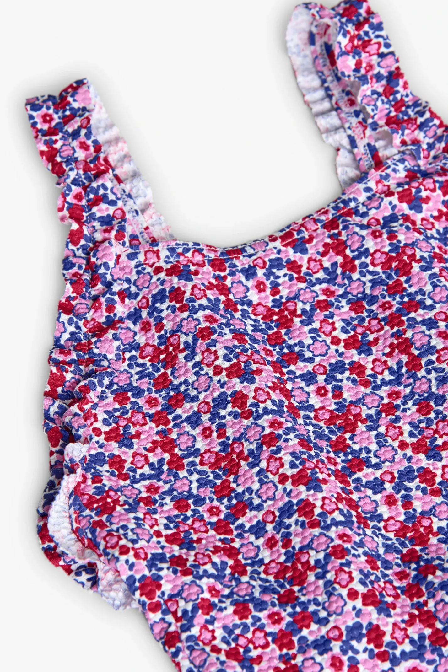 Costume da bagno in poliammide per bambina con stampa floreale in rosa e blu.