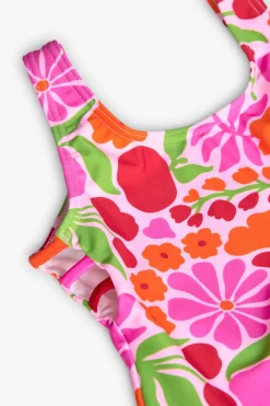 Costume da bagno in poliammide per bambina con stampa floreale dai colori vivaci.