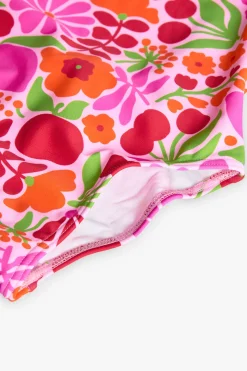 Costume da bagno in poliammide per bambina con stampa floreale dai colori vivaci.