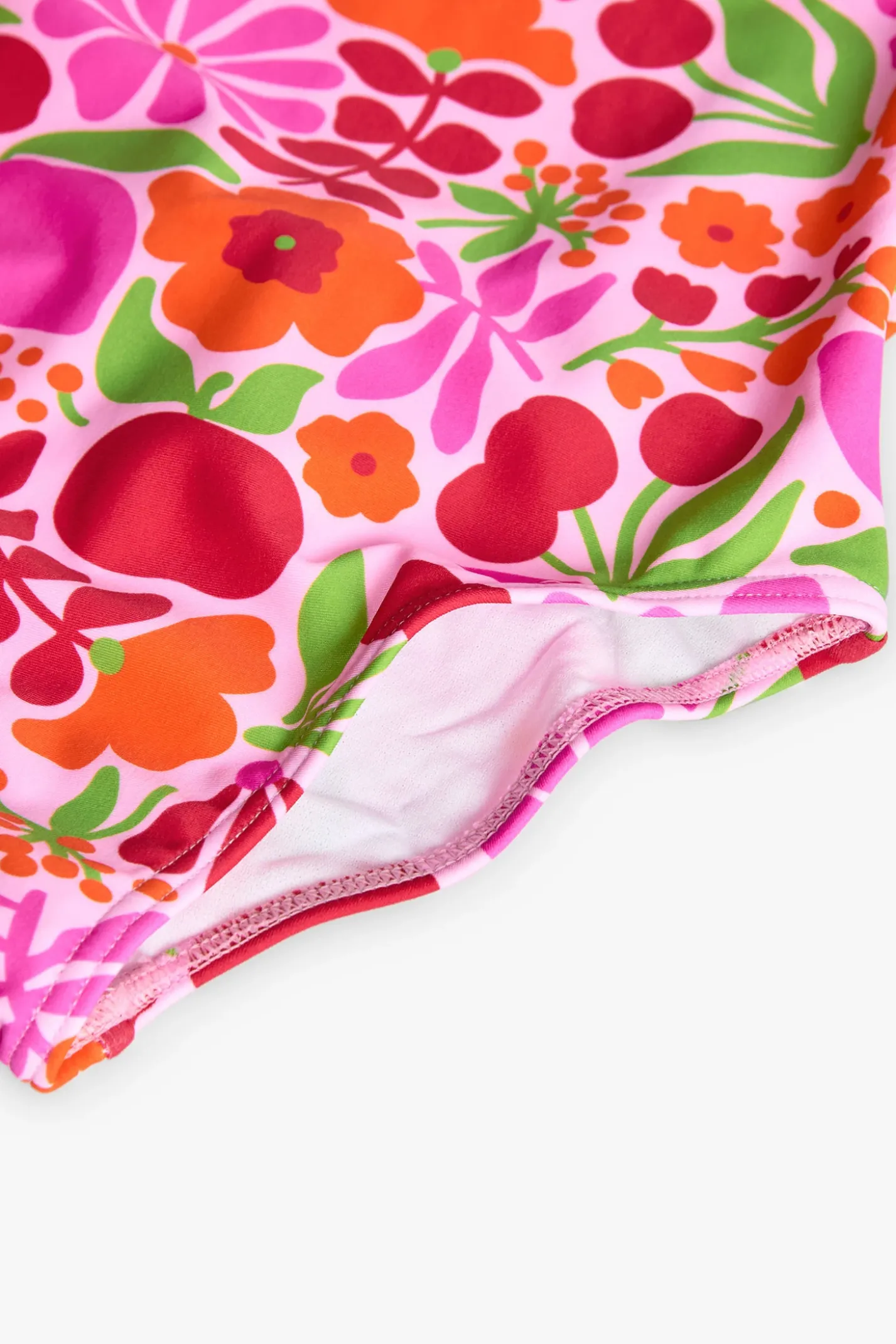 Costume da bagno in poliammide per bambina con stampa floreale dai colori vivaci.