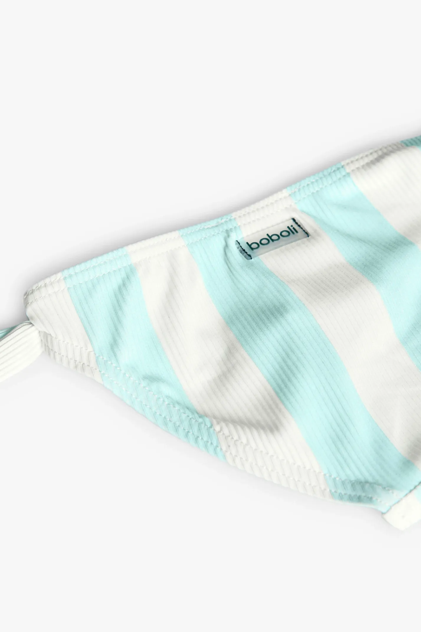 Costume da bagno mutandina in poliammide per neonata a righe blu e bianche.