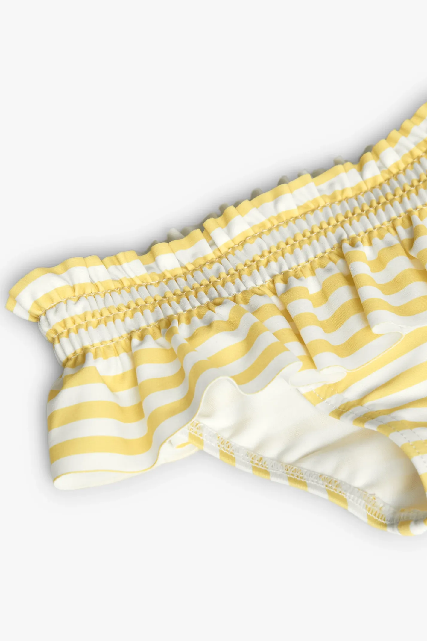 Costume slip in poliammide per neonata a righe gialle e bianche.