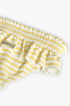 Costume slip in poliammide per neonata a righe gialle e bianche.