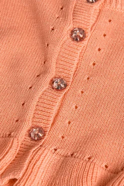 Giacca in maglia per neonato bambina di colore arancione.