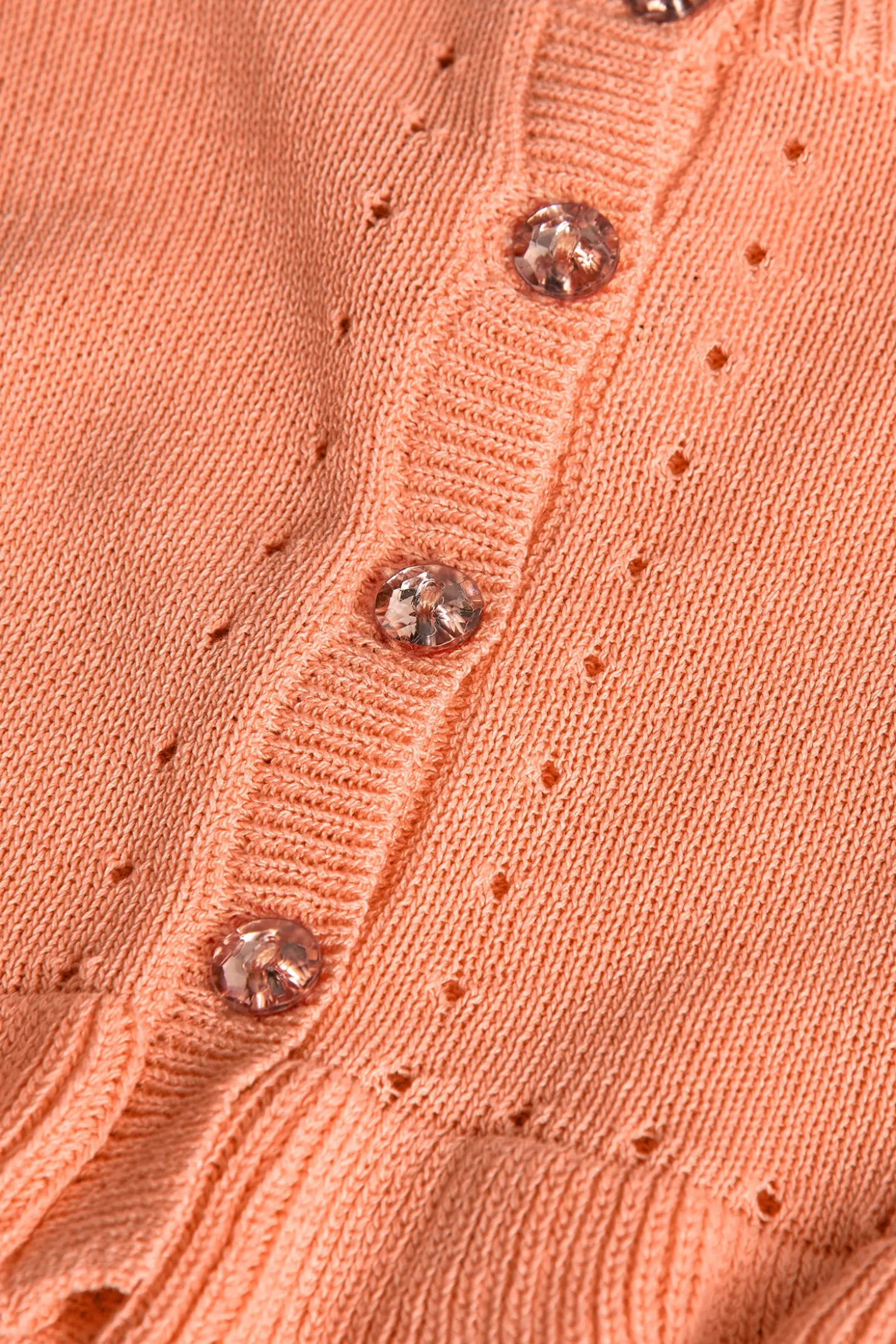 Giacca in maglia per neonato bambina di colore arancione.