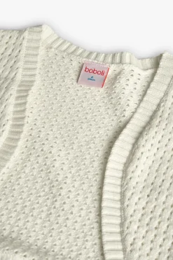 Giacca tricotosa per bambina di colore bianco.