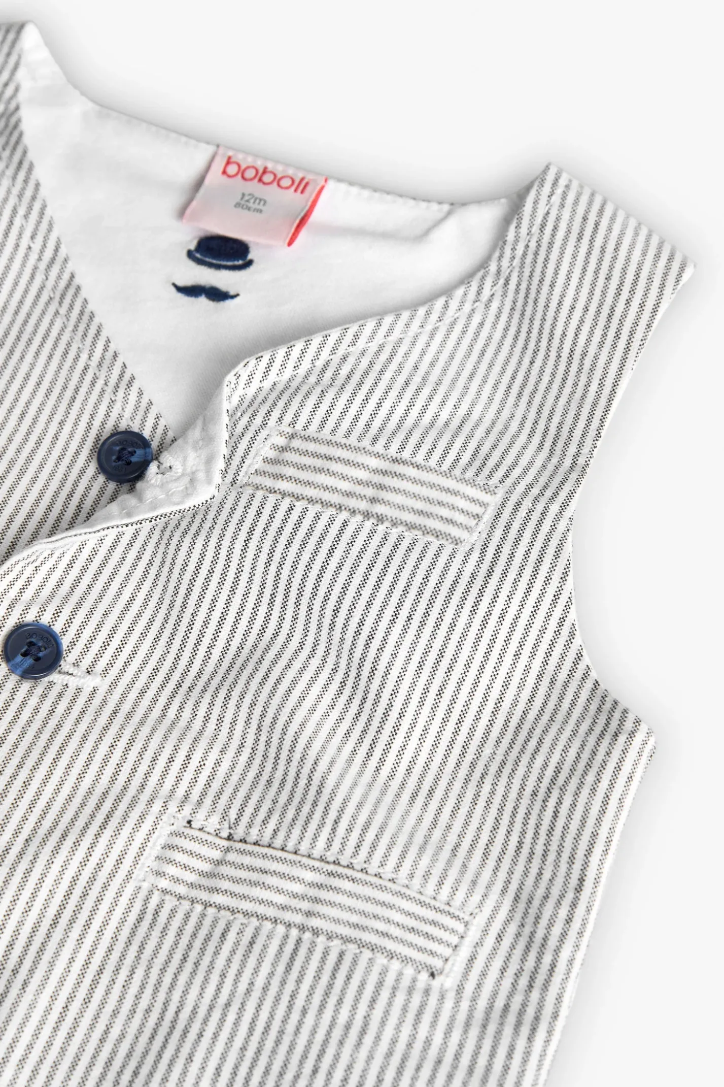 Gilet oxford per bambino a righe grigie e bianche.