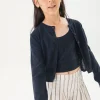 Gonna-pantaloncino in maglia per bambina con righe in bianco e nero.