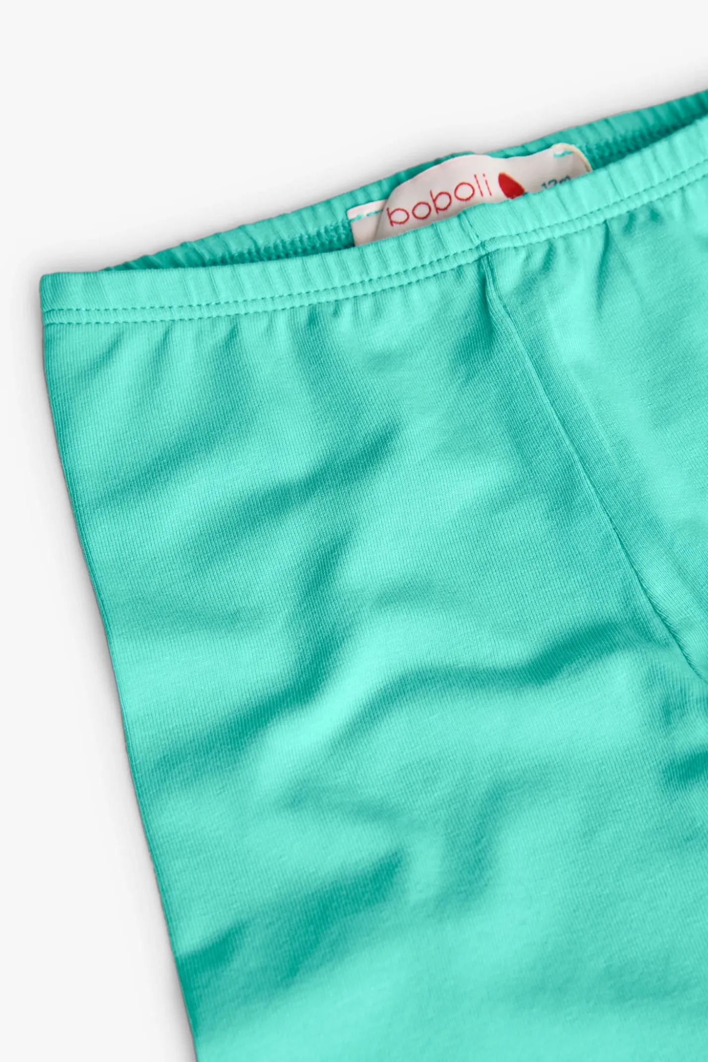 Leggings a maglia per bambina in colore verde.