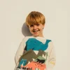 Maglietta a maglia per bambino in colore bianco con motivo di dinosauri
