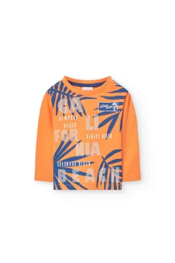 Maglietta a maglia per bambino in arancione a maniche lunghe.