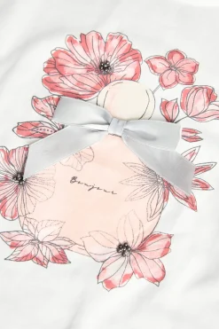 Maglietta a maglia per bambina in bianco con disegno di fiori
