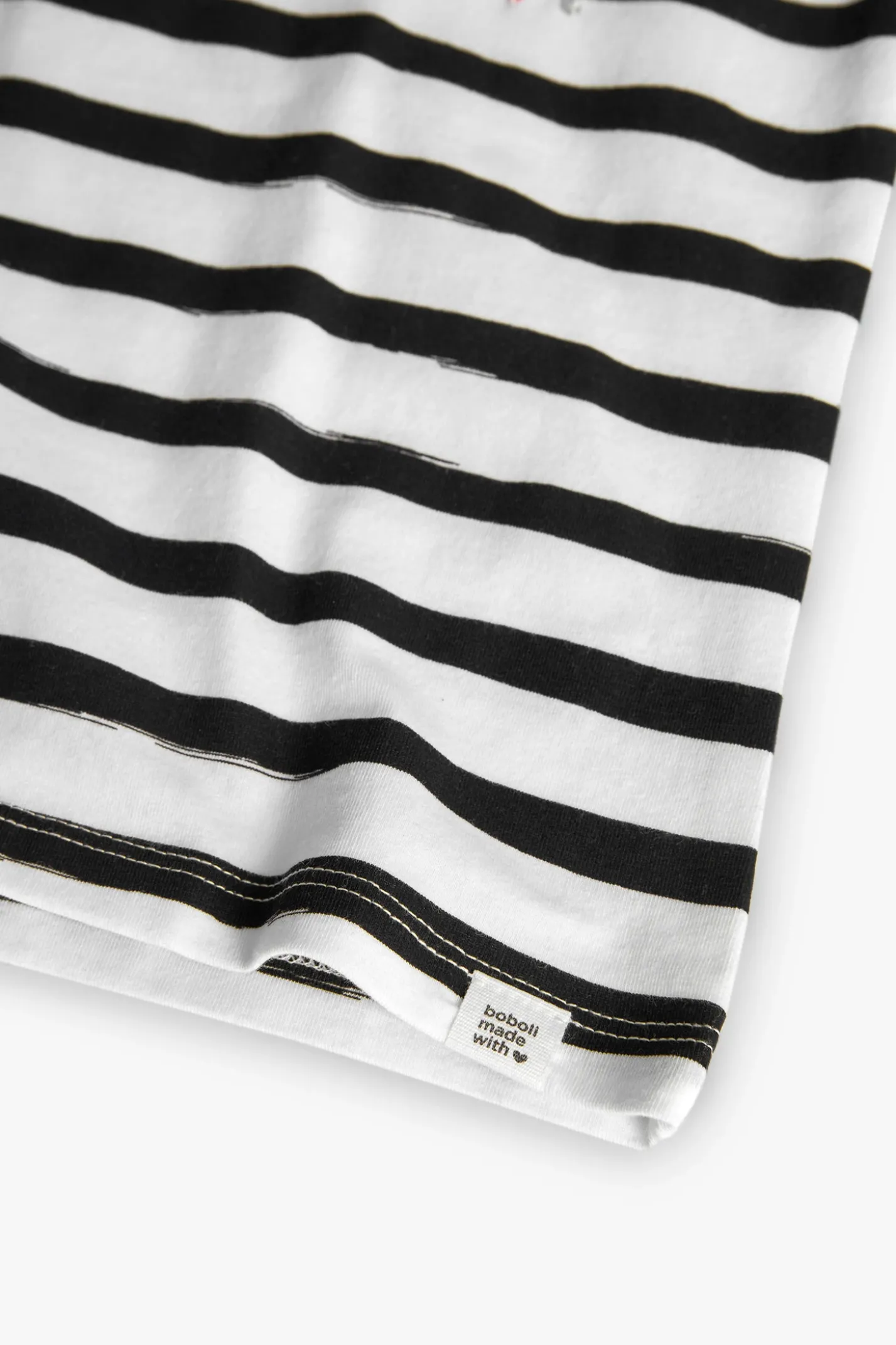 Maglietta a maglia per bambina con design a righe nei colori bianco e nero