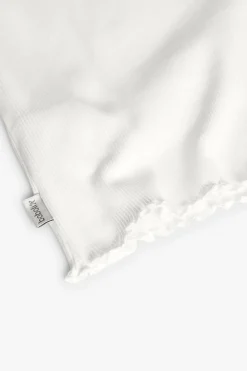 Maglietta basic in jersey per neonata di colore bianco.