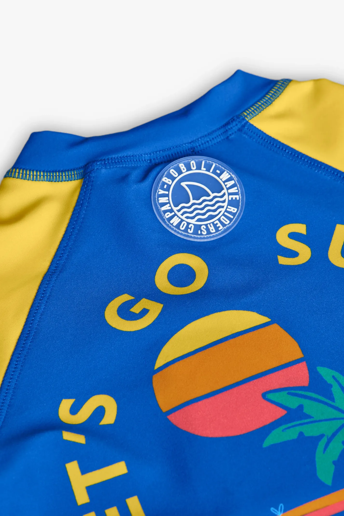 Maglietta da protezione solare per bambino in colore blu e giallo