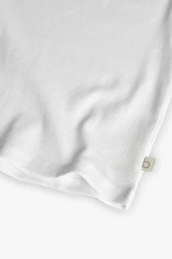 Maglietta di base in maglia per bambina di colore bianco.