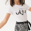 Maglietta di maglia elastica per bambina di colore bianco