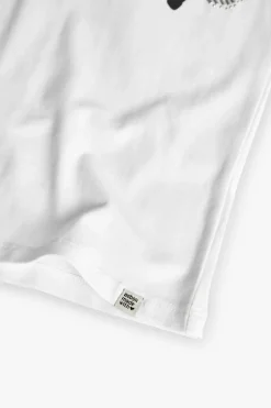 Maglietta di maglia elastica per bambina di colore bianco
