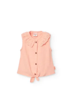 Maglietta di maglia per bebè femmina in colore salmone con dettaglio di pizzo.