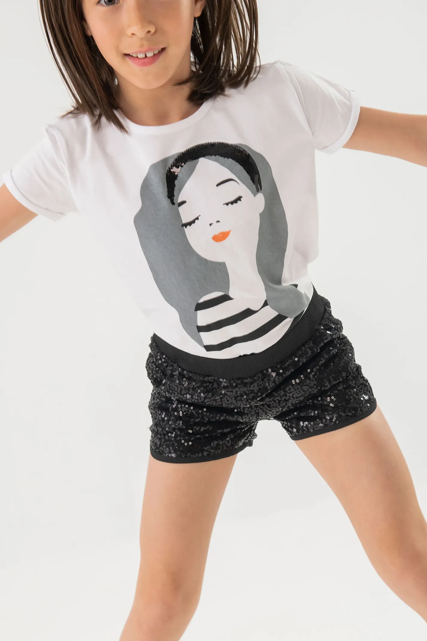 Maglietta di maglia per bambina di colore bianco con stampa di bambina.