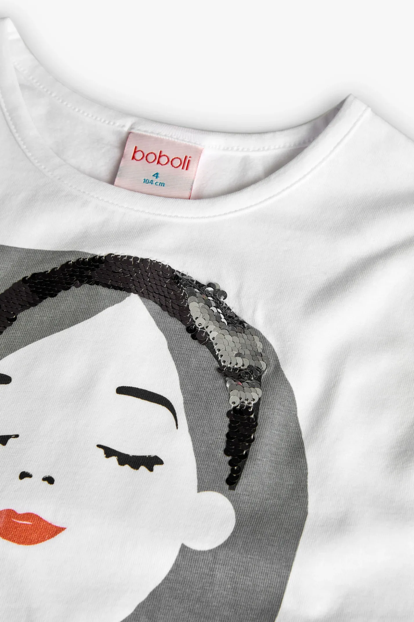 Maglietta di maglia per bambina di colore bianco con stampa di bambina.