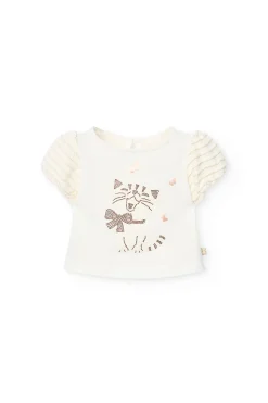Maglietta di maglia per neonata in colore bianco.