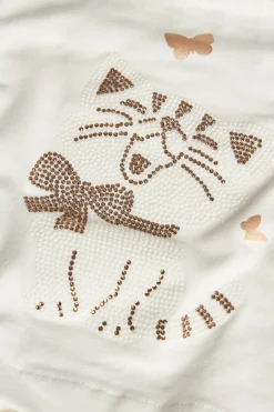 Maglietta di maglia per neonata in colore bianco.