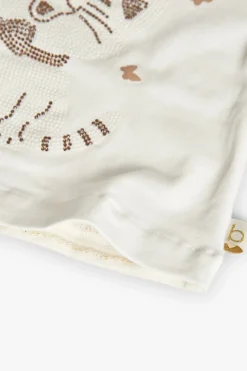 Maglietta di maglia per neonata in colore bianco.